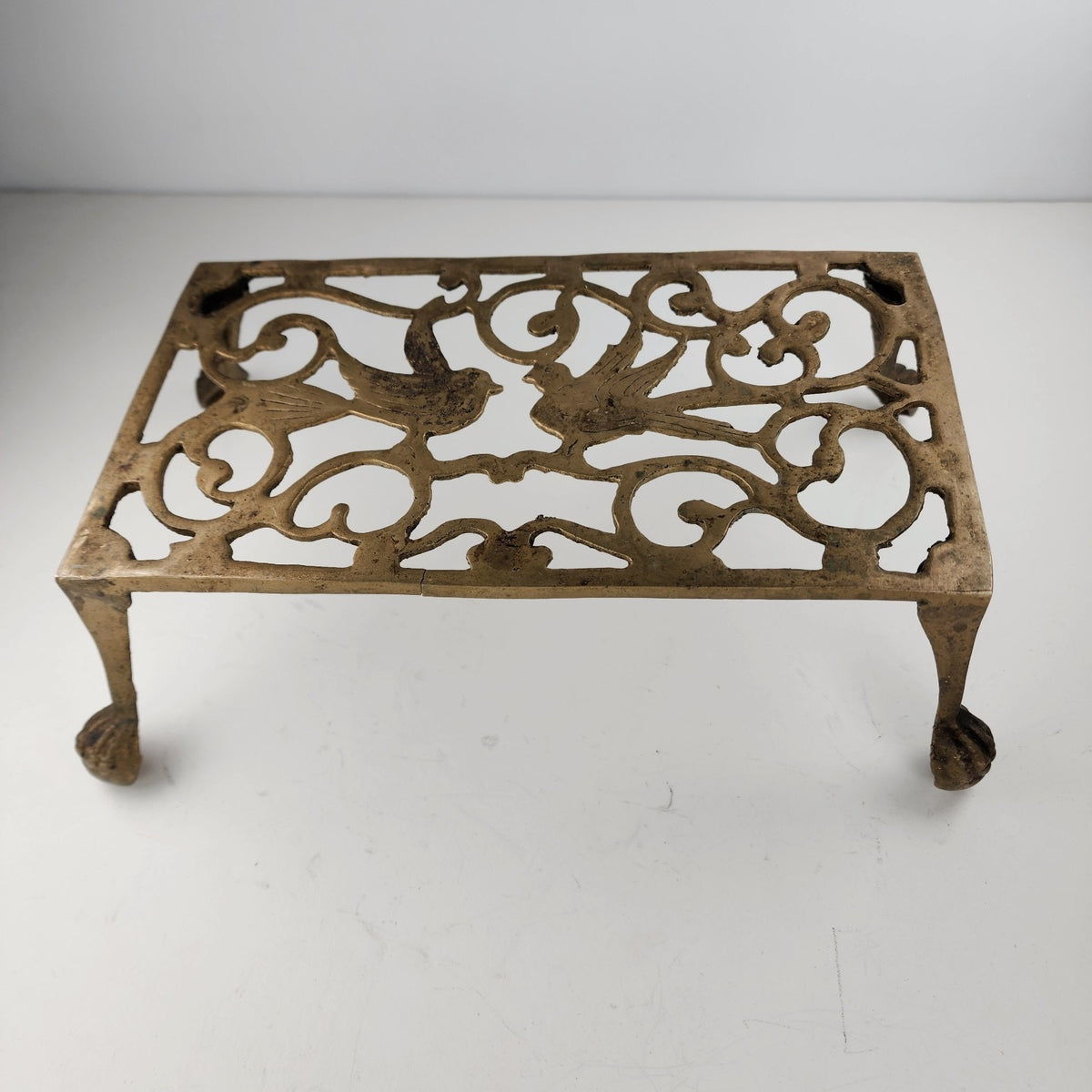 Antique Footed Brass Trivet Kettle Rest with Bird Decoration