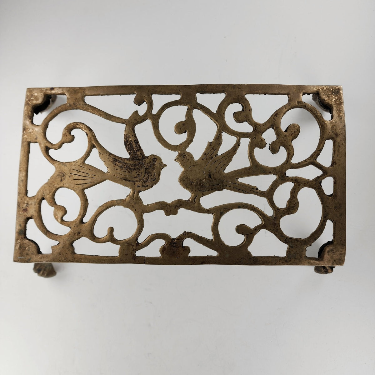 Antique Footed Brass Trivet Kettle Rest with Bird Decoration